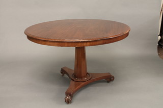A circular William IV snap top breakfast table, raised on a chamfered column with triform base 41"