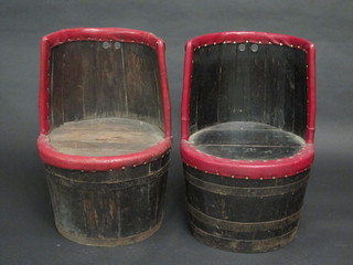 A pair of elm chairs formed from coopered barrels
