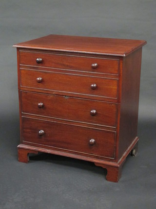 A 19th Century mahogany chest commode with hinged lid and  china liner, raised on bracket feet 25"
