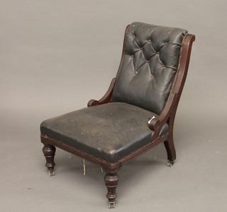 A Victorian mahogany show frame chair upholstered in black buttoned material, raised on turned supports