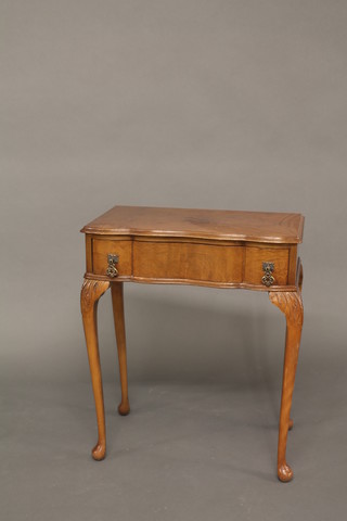 A Queen Anne style shaped walnut side table fitted a drawer and raised on cabriole supports 23"