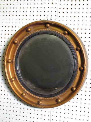 A circular convex plate wall mirror contained in a gilt ball  studded frame 16"
