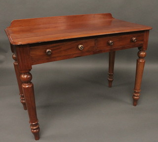 A Victorian mahogany side table with raised back fitted 2  drawers, raised on turned supports 42"