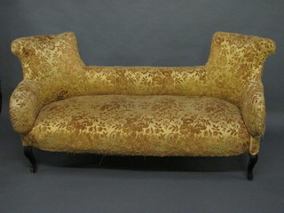 A Victorian mahogany framed sofa upholstered in yellow  material raised on cabriole supports 65"