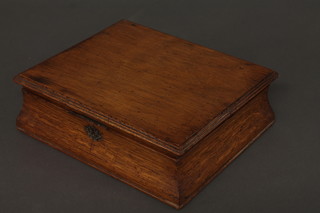 A Victorian oak lozenge shaped sewing box with hinged lid 11"
