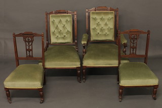 An Edwardian walnut 4 piece salon suite comprising open arm chair, nursing chair and a pair of standard chairs with pierced slat  backs