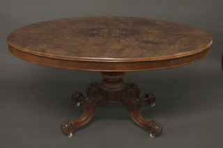 A Victorian inlaid oval figured walnut snap top Loo table, raised  on a pillar and tripod base 57"  ILLUSTRATED