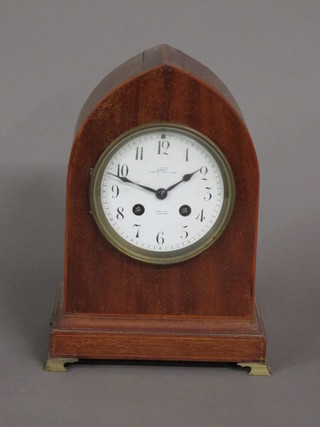 An Edwardian 8 day mantel clock with silvered dial and Arabic numerals contained in an inlaid mahogany lancet case by Dent