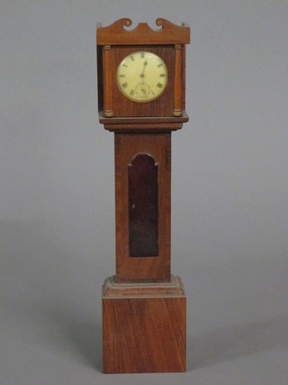 A novelty longcase clock, the upper section fitted an open face pocket watch, contained in a mahogany trunk 20"