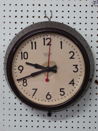 A Smiths electric wall clock with Arabic numerals contained in a brown Bakelite case 10"