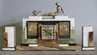 An Art Deco 3 piece clock garniture comprising striking mantel  clock contained in a 4 colour marble case surmounted by a figure  of a climbing lady and monkey, 24", together with 2 side pieces   ILLUSTRATED