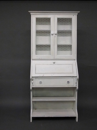 A white painted bureau bookcase, the upper section fitted adjustable shelves enclosed by grilled panelled doors, the base  fitted a fall front above 1 long drawer 33"
