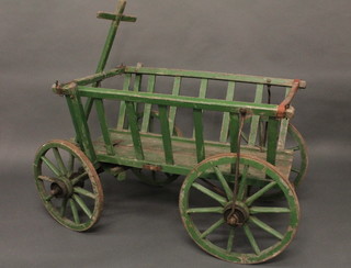 A green painted wooden cart with iron shod wheels 31"  ILLUSTRATED
