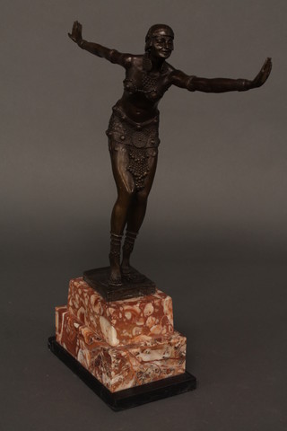 An Art Deco style bronze figure of a dancing lady raised on a  stepped marble base 18"