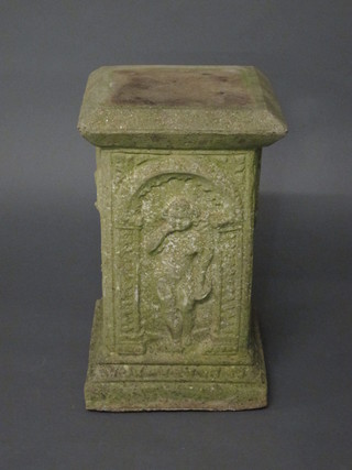 A well weathered square concrete garden plinth decorated  cherubs 22"