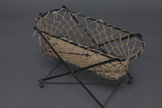 A 19th Century childs oval metal cot 26"