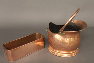 A copper helmet shaped coal scuttle and a rectangular planter