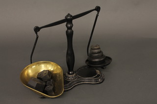 A pair of brass and iron pan scales complete with weights