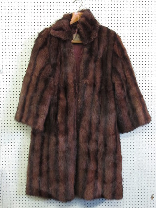 A lady's brown fur mink coat