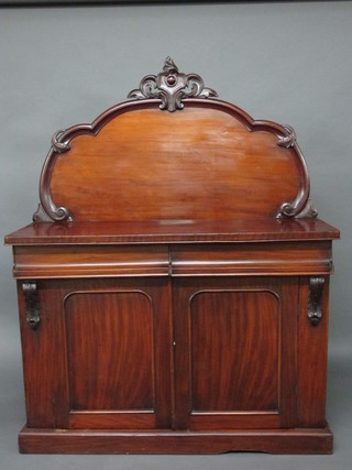 A Victorian mahogany chiffonier with raised back, the base fitted  2 drawers above a double cupboard enclosed by panelled doors,  raised on a platform base 48"