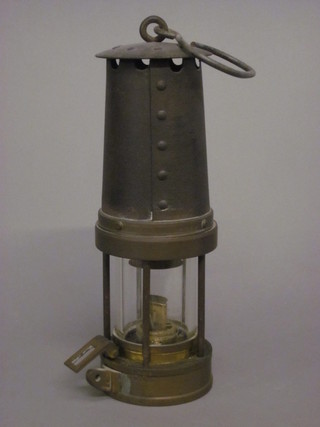 A miner's safety lamp  ILLUSTRATED