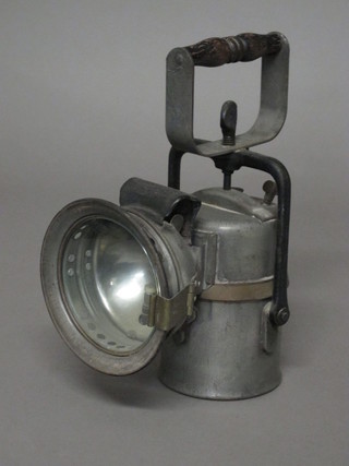 A large carbide inspection lamp by Premier Lamp Co. with carrying handle