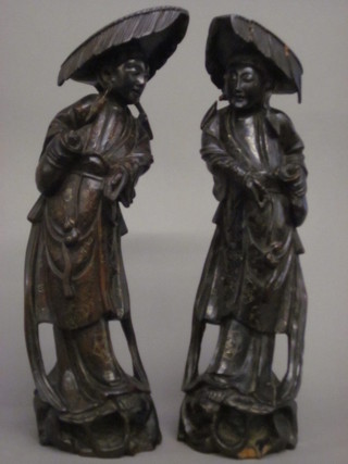 A pair of Eastern hardwood figures with inlaid silver decoration 15"