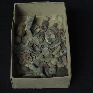 A box containing a collection of various curios etc