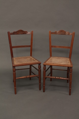 A pair of carved walnut bedroom chairs