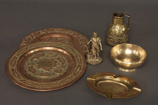 An Eastern embossed brass jug 5", a pair of pierced circular Eastern copper dishes 11", a figure of a blacksmith, a brass  ashtray and a polished metal bowl