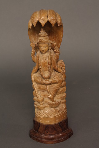 A carved Indian figure of a Deity 14"