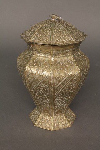 An Eastern gilt metal octagonal urn and cover 11"