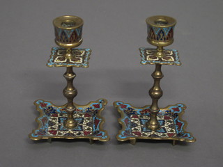 A pair of champs leve enamelled candlesticks 4 1/2"