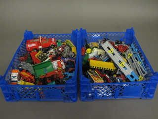 2 blue plastic crates containing a collection of toy cars