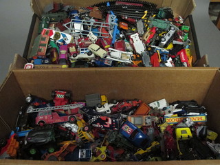 2 boxes containing a collection of toys cars