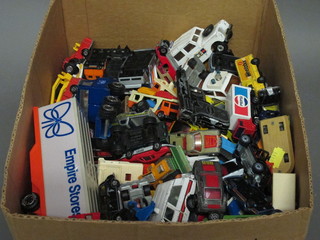 A box containing a large collection of toy cars