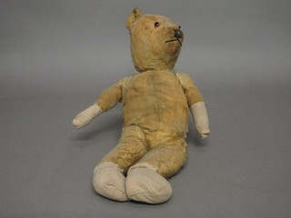 A balding yellow bear with articulated limbs 19"