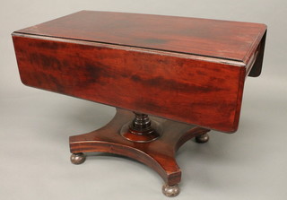 A 19th Century mahogany pedestal Pembroke table fitted a frieze  drawer, raised on a turned column with triform base 41"