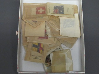 A collection of silk cigarette tea cards