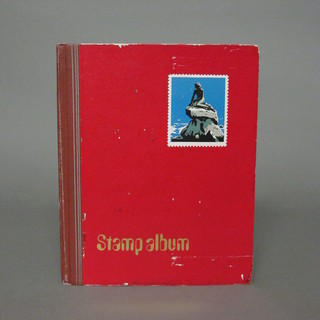 A red stock book of various stamps