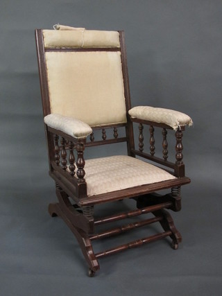 An American mahogany framed rocking chair