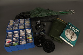 2 multiplying fishing reels, 3 nets etc, all contained in a black plastic box