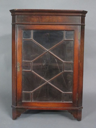 A Georgian style mahogany corner cabinet, fitted shelves  enclosed by an astragal glazed panelled door 22"