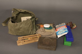 A canvas bag containing a collection of various fishing  equipment