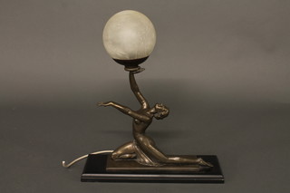 An Art Deco style table lamp in the form of a spelter lady with globe, 15"