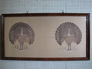 An Eastern silk panel with 2 gold wire embroidered figures of mythical birds 20" x 40"
