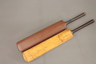 A J Salter & Sons cricket bat, a Dunn & Moore cricket bat and a hickory shafted golf iron, head rusted,