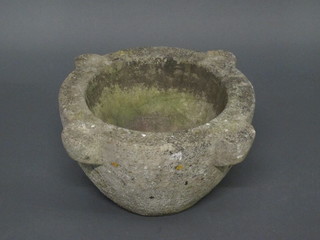 A circular stone mortar 20"