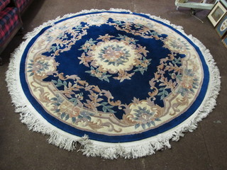 A circular blue ground and floral patterned Chinese rug 75"