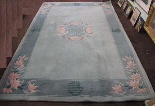 A turquoise ground and floral patterned Chinese carpet 109" x  72"